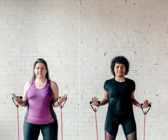two-women-with-resistance-bands